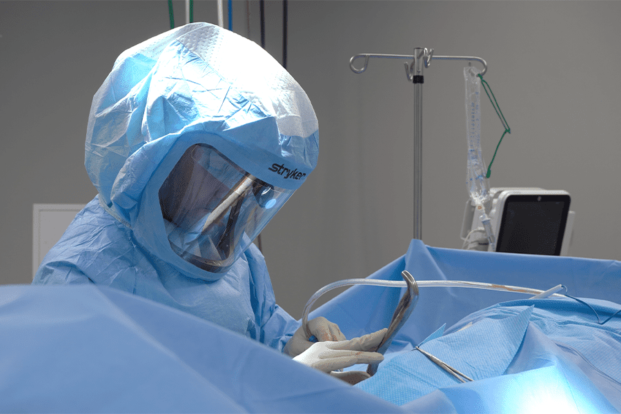 Surgeon at Louisville Hip & Knee Institute operates on a patient.