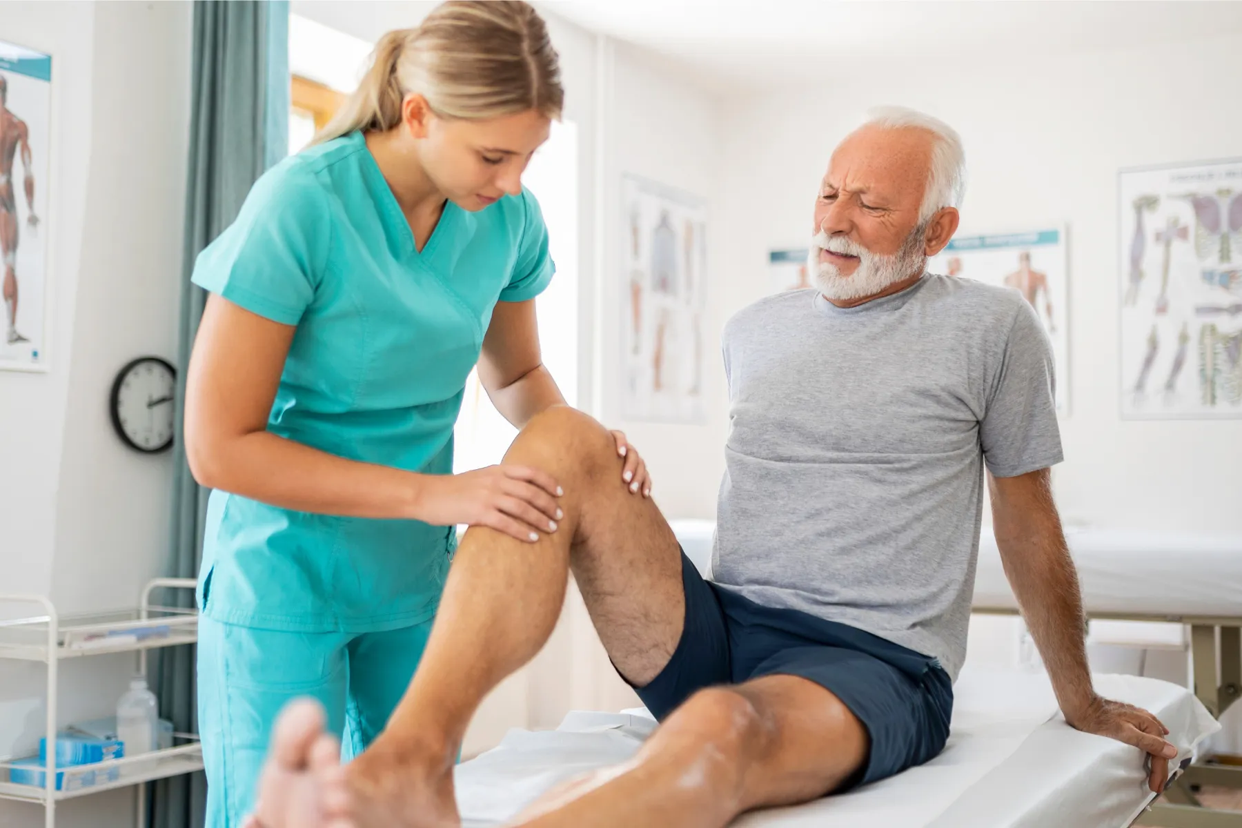 Physician checking on patients knee
