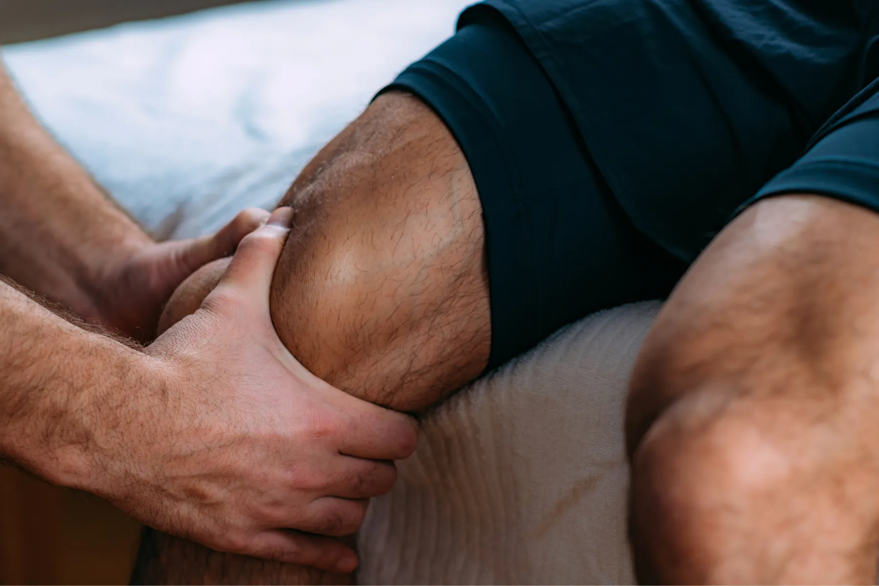 Featured Image Physician checking on patients knee